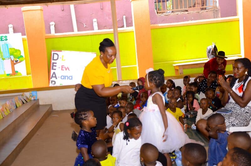 Caregiver attending to young children on DEAR Day