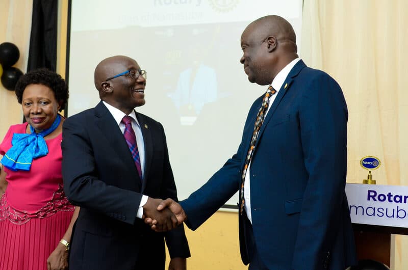 Rotarians shaking hands in fellowship at the 9th Presidential Installation