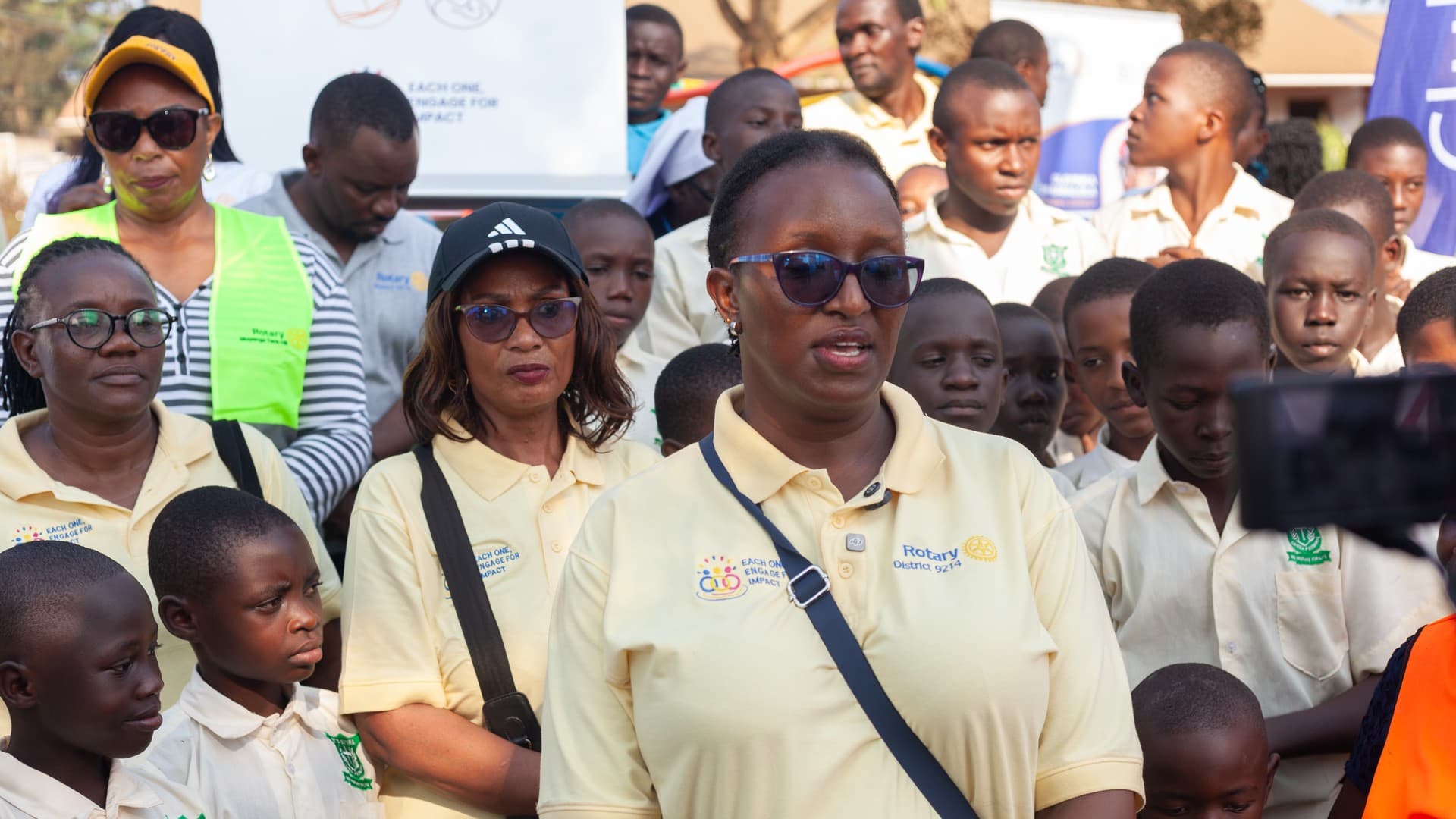 Rotarians and community youth engaged in Double Impact community service