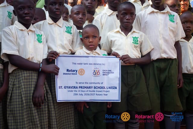 St. Gyavira Primary School pupils with the 10 Days of Double Impact water tank dedication